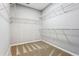 Spacious walk-in closet with carpet floors and wire shelving at 7160 Fawn Lake Dr, Alpharetta, GA 30005
