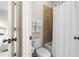 Full bathroom with a shower, towel rack, and a door leading to a cozy bedroom at 1215 Renaissance Se Ct, Mableton, GA 30126