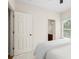 Bright bedroom featuring a ceiling fan, connecting bathroom, and cozy carpet at 1215 Renaissance Se Ct, Mableton, GA 30126