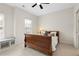 Bedroom with a large window and a custom window bench with a cozy nook at 1215 Renaissance Se Ct, Mableton, GA 30126