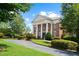 Beautiful clubhouse surrounded by landscaped grounds, showcasing the building's architecture at 1215 Renaissance Se Ct, Mableton, GA 30126