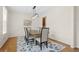 Dining room features modern light fixture, wainscotting, and hardwood floors at 1215 Renaissance Se Ct, Mableton, GA 30126