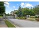 Gated entrance to a residential community with brick pillars and well-maintained landscaping at 1215 Renaissance Se Ct, Mableton, GA 30126