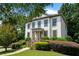 Charming two-story home with well-manicured landscaping and covered front porch at 1215 Renaissance Se Ct, Mableton, GA 30126