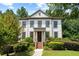 Charming two-story home with well-manicured landscaping and covered front porch at 1215 Renaissance Se Ct, Mableton, GA 30126