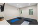 Bright fitness room with black floor mats and mounted TV at 1215 Renaissance Se Ct, Mableton, GA 30126