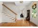Bright foyer features hardwood floors, staircase, and view of office at 1215 Renaissance Se Ct, Mableton, GA 30126