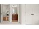 Hallway featuring a bedroom and a bathroom with closet doors at 1215 Renaissance Se Ct, Mableton, GA 30126