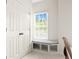 Hallway featuring built in window bench, storage, and natural light at 1215 Renaissance Se Ct, Mableton, GA 30126