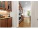 Beautiful kitchen area with stainless appliances, tile backsplash, and dark wood cabinets at 1215 Renaissance Se Ct, Mableton, GA 30126