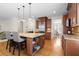 Spacious kitchen island with granite countertops, wooden cabinets and hardwood floors at 1215 Renaissance Se Ct, Mableton, GA 30126