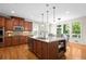 Open kitchen with a granite island, stainless steel dishwasher, and a bright breakfast area at 1215 Renaissance Se Ct, Mableton, GA 30126