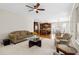Open-concept living area with a fireplace, an adjacent breakfast area, and hardwood floors at 1215 Renaissance Se Ct, Mableton, GA 30126