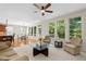 Spacious living area with a fireplace, an adjacent breakfast area, and hardwood floors at 1215 Renaissance Se Ct, Mableton, GA 30126
