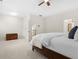 This spacious bedroom features carpet floors, tray ceiling, and view to a bathroom at 1215 Renaissance Se Ct, Mableton, GA 30126