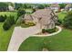 Spacious two story home with a three car garage, mature trees, and well manicured landscaping at 2602 Alcovy Club Dr, Dacula, GA 30019