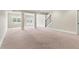 Spacious basement featuring plush carpeting, abundant natural light, and flexible living space at 2602 Alcovy Club Dr, Dacula, GA 30019