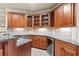 Basement bar area featuring granite countertops, custom cabinets, wine rack, and beverage fridge at 2602 Alcovy Club Dr, Dacula, GA 30019