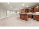 Expansive basement with plush carpet, custom bar area, and ample room for entertaining at 2602 Alcovy Club Dr, Dacula, GA 30019