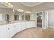 Spacious bathroom featuring a double vanity with granite countertops and tile flooring at 2602 Alcovy Club Dr, Dacula, GA 30019