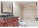 Elegant bathroom with carved vanity, black granite countertop, shower with tile surround, and soaking tub at 2602 Alcovy Club Dr, Dacula, GA 30019