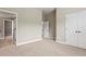 Bedroom with carpet flooring, white trim, and view of en suite bathroom at 2602 Alcovy Club Dr, Dacula, GA 30019