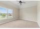 Bedroom with a large window offering a view of the neighborhood at 2602 Alcovy Club Dr, Dacula, GA 30019