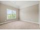 Bedroom with carpet flooring and a large window offering a view of nature at 2602 Alcovy Club Dr, Dacula, GA 30019