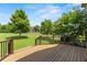 Spacious deck offering serene views of the lush backyard and mature trees at 2602 Alcovy Club Dr, Dacula, GA 30019