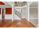 Foyer showcasing hardwood floors, view to the staircase and balcony, and open floor plan at 2602 Alcovy Club Dr, Dacula, GA 30019