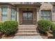 Close-up of the home's entry with double doors and brick stairs at 2602 Alcovy Club Dr, Dacula, GA 30019