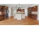 Spacious kitchen with an island, custom cabinetry, granite countertops, and stainless steel appliances at 2602 Alcovy Club Dr, Dacula, GA 30019