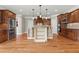 Open kitchen boasting an island, stainless-steel appliances, and beautiful custom cabinets at 2602 Alcovy Club Dr, Dacula, GA 30019