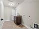 This laundry room features tile flooring, utility sink, and convenient washer/dryer hookups at 2602 Alcovy Club Dr, Dacula, GA 30019