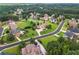 Aerial view showcasing the residential area, mature trees, and surrounding community at 2602 Alcovy Club Dr, Dacula, GA 30019