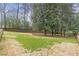 Large, green backyard with a wood privacy fence enclosing the area at 1631 Dresden Ne Dr, Brookhaven, GA 30319