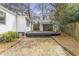 The brick-paved backyard leads to a detached garage with a deck and provides ample outdoor space at 1631 Dresden Ne Dr, Brookhaven, GA 30319