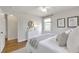 Bright bedroom features a window, rug, and white dresser at 1631 Dresden Ne Dr, Brookhaven, GA 30319