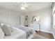 Bedroom with a ceiling fan, white dresser and closets at 1631 Dresden Ne Dr, Brookhaven, GA 30319