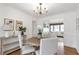 Dining room has natural light, hardwood floors, chandelier, and modern decor accents at 1631 Dresden Ne Dr, Brookhaven, GA 30319