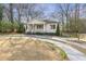 Charming home with a welcoming front porch and a well-manicured yard at 1631 Dresden Ne Dr, Brookhaven, GA 30319
