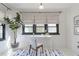 Well-lit home office with white walls, a large window, and a stylish desk area at 1631 Dresden Ne Dr, Brookhaven, GA 30319