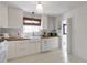 Bright kitchen with white cabinets, butcher block counters, and a farmhouse sink at 1631 Dresden Ne Dr, Brookhaven, GA 30319