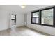 Bright living room featuring large windows and neutral tile flooring at 1631 Dresden Ne Dr, Brookhaven, GA 30319