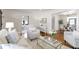 Cozy living room with neutral furniture, hardwood floors, and an open layout at 1631 Dresden Ne Dr, Brookhaven, GA 30319
