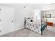 Finished basement bedroom with carpeting, closet, door, and bed with floral bedding at 8073 Ridge Vly, Woodstock, GA 30189