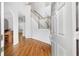 Bright foyer with hardwood floors and staircase, leading to other rooms at 8073 Ridge Vly, Woodstock, GA 30189
