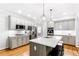 Updated kitchen with a large island, stainless steel appliances, and custom cabinets at 8073 Ridge Vly, Woodstock, GA 30189