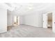 Large main bedroom with ceiling fan, neutral colors, and access to ensuite bathroom at 8073 Ridge Vly, Woodstock, GA 30189