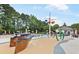 Fun pool area features a splash pad, sun loungers, umbrellas, and a clubhouse for relaxation at 8073 Ridge Vly, Woodstock, GA 30189